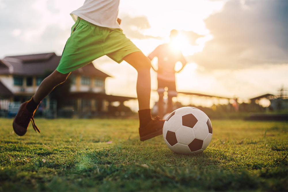 kids playing soccer outside