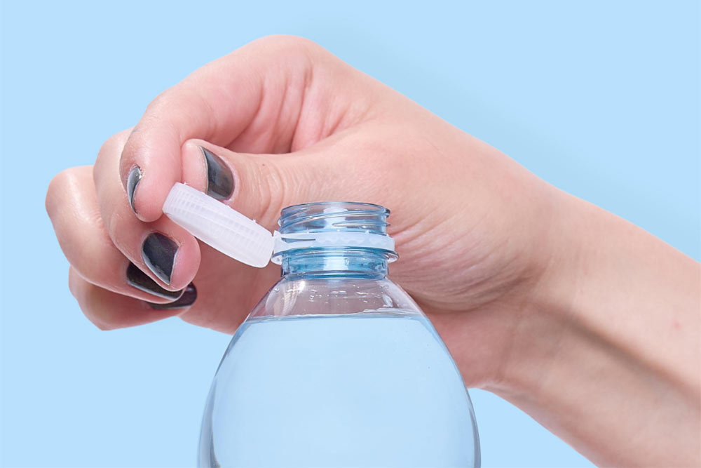 woman hand opening water bottle cap